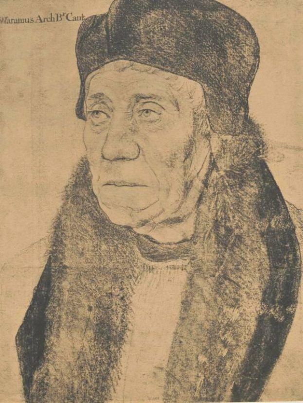 Eine ältere Frau mit schwarzem Hut und Nerzstola, die höflich die Hände öffnet und zur Seite schaut.