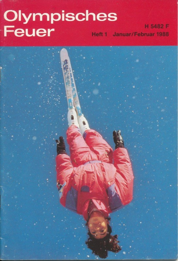 Titelbild "Olympische Spiele Feuer - Heft 1 - Januar/Februar 1988" mit einem Skifahrer in der Luft, der einen Ski-Anzug trägt.