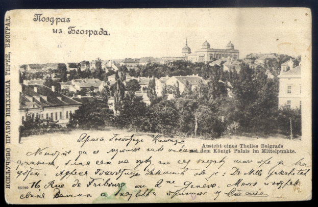 Alte Postkarte mit Stadtansicht, Gebäuden und Bäumen, mit teilweise lesbarer Handschrift.