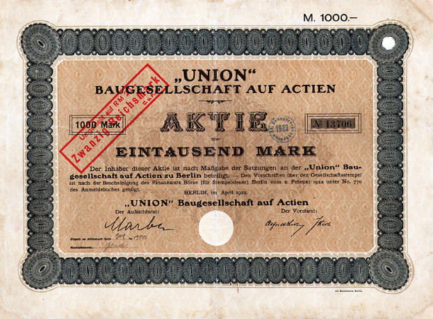 Ein altes deutsches Banknoten mit einem roten Stempel und Text, der darauf hinweist, dass es sich um einen Aktienschein handelt.