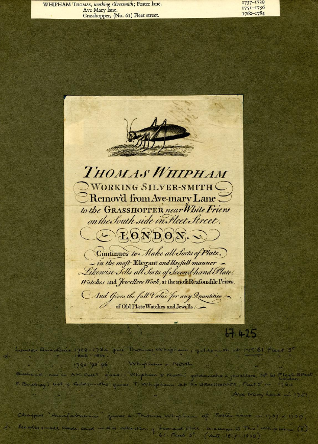 Altes Buch mit einer Zeichnung eines Grashüpfers auf dem Cover, das handgeschriebene Text auf dem Papier enthält.