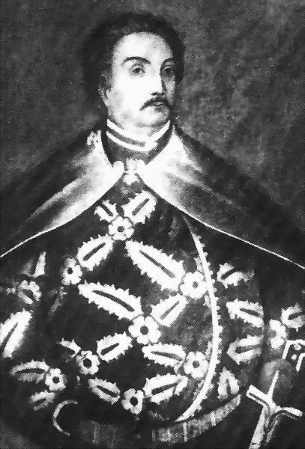 Schwarzes und weißes Foto von Papst Johannes Paul II. in Priesterkleidung, der eine schwarze Robe mit weißem Kragen und Manschetten trägt und die Hände verschränkt.